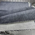 Yakın çekim kalın mavi renk toptan parça kot kumaş dokusu ve likrasız denim yapısı